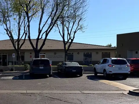 The single-story Glendale office building on Bell Road, with parking in front